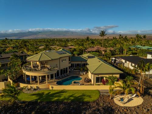 Kamuela House | Spacious Mauna Lani Luxury Home with Panoramic Golf Course and Volcano Views, Private Pool and Hot Tub, Two Golf Carts, and E-Bikes for Family Adventures