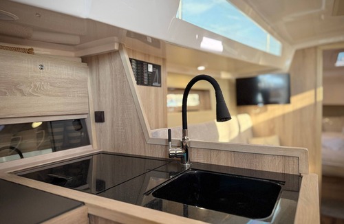 Ostholstein Boat Rental | Boat 'Hausboot Segelyacht Nui' on the sea and Private Terrace