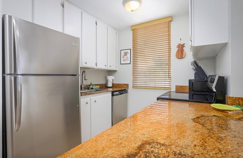 Historic Kailua Village Condo | Experience oceanfront luxury at Hale Kona Kai 301, a perfect getaway.