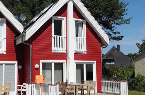 Glowe House | Felilotte Vacation Home in Glowe. Spacious patio with lounge chairs and an electric grill. Pure relaxation in the infrared sauna. Cozy living area with Apple TV and a fireplace. Dogs are welcome