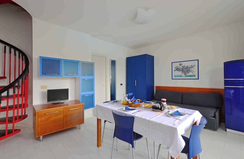 Lignano Pineta Apartment | Holiday apartment with air conditioning, balcony and pool