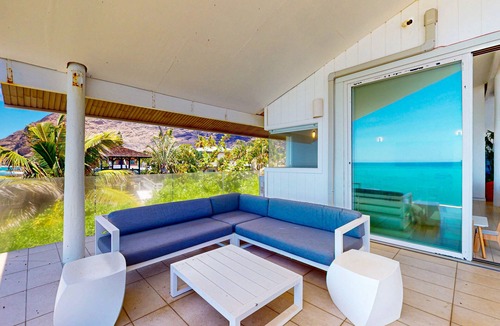 Makaha House | Oceanfront home with wrap around lanai, private sauna, beach access & WIFI