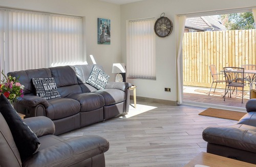 Poole Cottage | This pet-friendly property is family retreat.