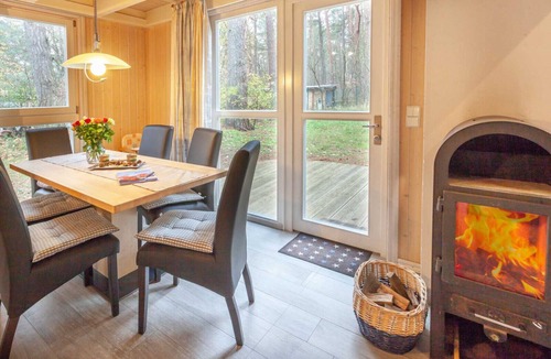 Gohren House | Vacation Home "Haus am Meer 283" in Baabe. Awarded the FeWoAirClean seal. Idyllic location in a pine forest with a balcony and terrace. Cozy evenings by the fireplace and soothing relaxation in the sauna