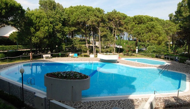 Apartment with pool by the sea