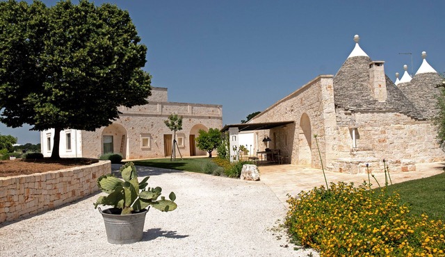 Middle trulli, ancient stone house in Cisternino