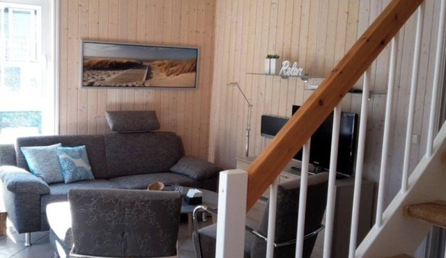 Sommerwind 202 Vacation Home in Baabe. Electric fireplace for a cozy, relaxing atmosphere. A sunny terrace for relaxing vacation moments. Soothing Relaxation in the Sauna in Baabe