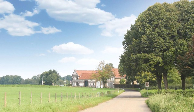 This characteristic square square farmhouse is beautifully situated in the South Limburg hills. in Nuth